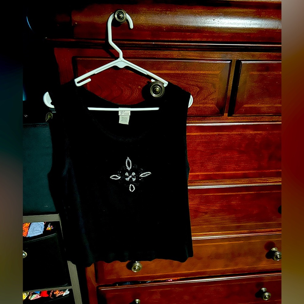 Last Chance Donating next week. Black knit over vest. Sequins on front.